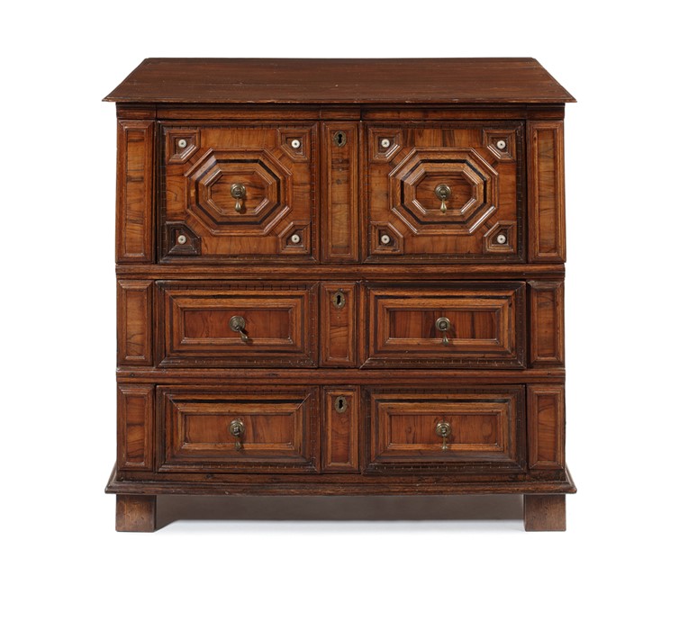 A William and Mary olive and oak geometrically-moulded three-drawer chest