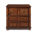 A William and Mary olive and oak geometrically-moulded three-drawer chest