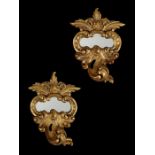 An 18th century Venetian carved giltwood mirror and one to match of later date