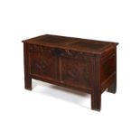 A Charles II oak panelled chest