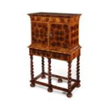 A small William and Mary olive wood oyster veneered and crossbanded cabinet on stand
