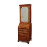 A small George II figured walnut crossbanded and featherbanded bureau bookcase