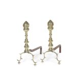A pair late 18th/early 19th century North American polished brass andirons