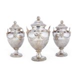 A set of three George III vase-shaped silver tea caddies, maker's mark indistinct, London, 1769