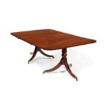 A Regency mahogany twin pedestal dining table and leaf