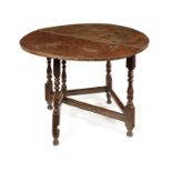A Charles II oak half-round folding table
