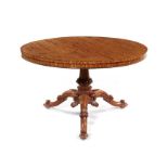 A fine Victorian satinwood carved circular centre table