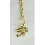 A yellow metal Egyptian pendant and chain, marked 750, 3.4g.