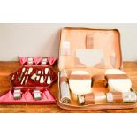 A gentlemans travelling vanity set, the case GHPD, together with travelling sewing set, red velvet
