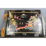 A Japanese black lacquered painted and mother of pearl inlaid photograph album.