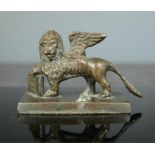 A small winged bronze lion. 5cm high