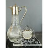 A Stuart crystal mantle clock etched with Fuchsia's, together with a Claret jug with silver plated