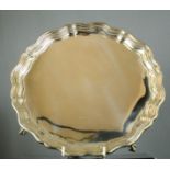 A Chippendale style silver salver with piecrust edge on four ball and claw feet, Sheffield 1924,