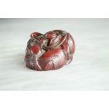 A Japanese carved bead in the form of ducks amidst lotus flowers. 3cm high