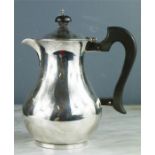 A silver hot water jug, Sheffield 1933, 16.68toz.