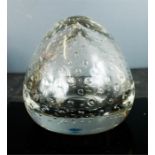 A large glass paperweight, hand blown with decorative air bubbles. 16cm