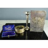 A silver bud vase 10cm high, a silver napkin ring, a Gentleman's tie pin in the original box Henry &