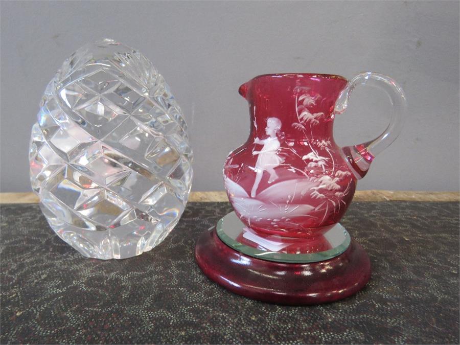 A gut glass egg form paperweight together with a Victorian cranberry glass jug. - Image 2 of 2