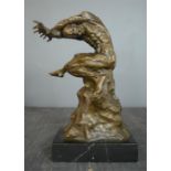 A bronze figure of a screaming man, 32cm high.