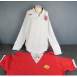 Two football shirts; England Euro 2012 replica, and 1973 Manchester United No. 7 replica.