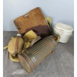 A group of militaria to include a gas mask, aluminium canteen, and a goat skin back pack and