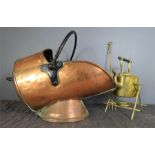 A helmet copper coal scuttle, kettle and stand in brass, and a toasting fork.