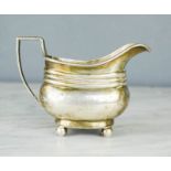 A silver milk jug, London 1907, 3.75toz. 8cm high