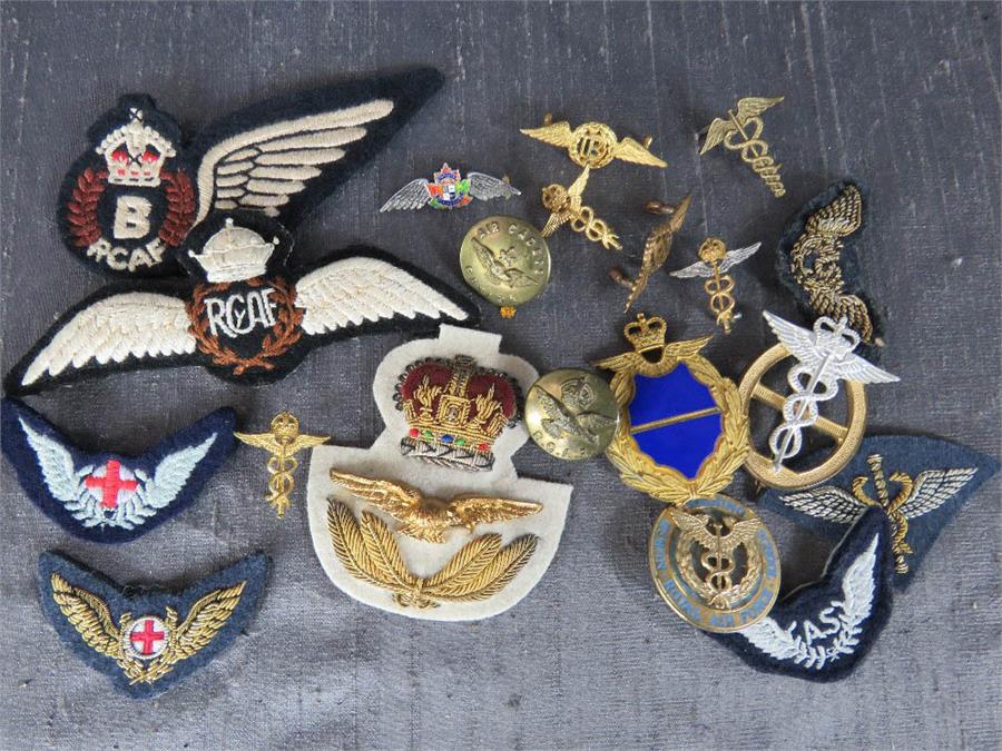A selection of RAF and RCAF badges, wings, buttons, etc.