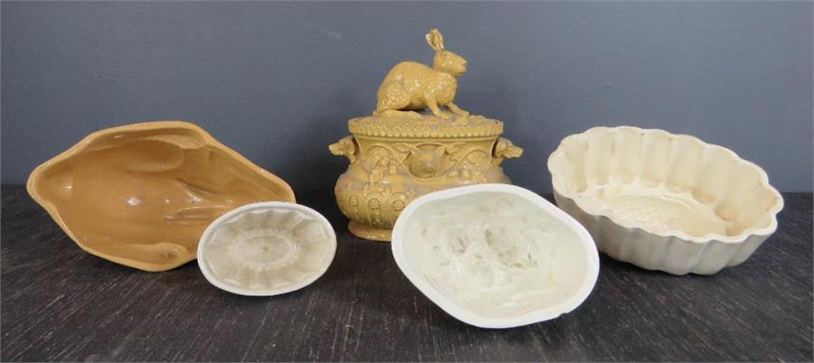 A Spode Staffordshire pottery strawberry jelly mould, a rabbit jelly mould, a small strawberries