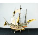 A model galleon ship, The Golden Hind, painted with detail, 56 by 76cm.