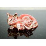 A Japanese red jade bead, signed to the base, in the form of a cat and kittens.