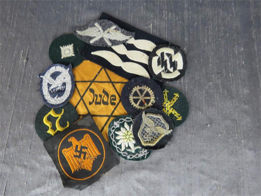 A group of German Nazi cloth badges.