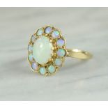 A 9ct gold and opal flower-head ring, 3.5g.