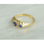 An 18ct gold and blue paste ring with chip diamonds, Chester hallmark, 2g.