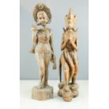 Two carved Indonesian figures.