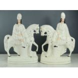 A pair of 19th century Staffordshire figures on horseback.