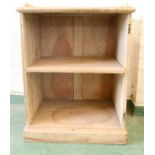 An antique pine cupboard with single shelf.