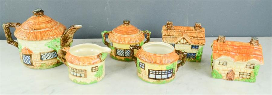 A Beswick tea set, together with two lidded pots, in the cottage pattern.