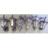 A group of six outdoor modern wall lanterns.