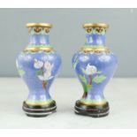A pair of Cloisonne vases on stand.