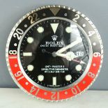 A Rolex style wall clock.