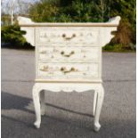 A Chinese white lacquered cabinet with mother of pearl figures and gilded highlights.