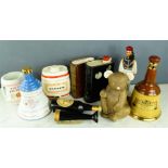 A group of collectable alcohol bottles, and Guinness advertising brushes. (no contents)