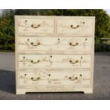 A Chinese white lacquered chest of drawers with mother of pearl figures and gilded highlights.