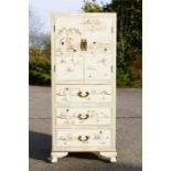 A pair of Chinese white lacquered cabinets with mother of pearl figures and gilded highlights.