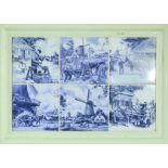 A framed group of six blue and white tiles.