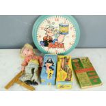 A group of toy collectables including Popeye clock, puppet, Porky pig etc.
