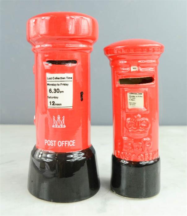 Two money boxes in the form of red letter boxes.