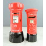 Two money boxes in the form of red letter boxes.