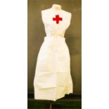 An antique linen nurses uniform; pinafore and skirt.